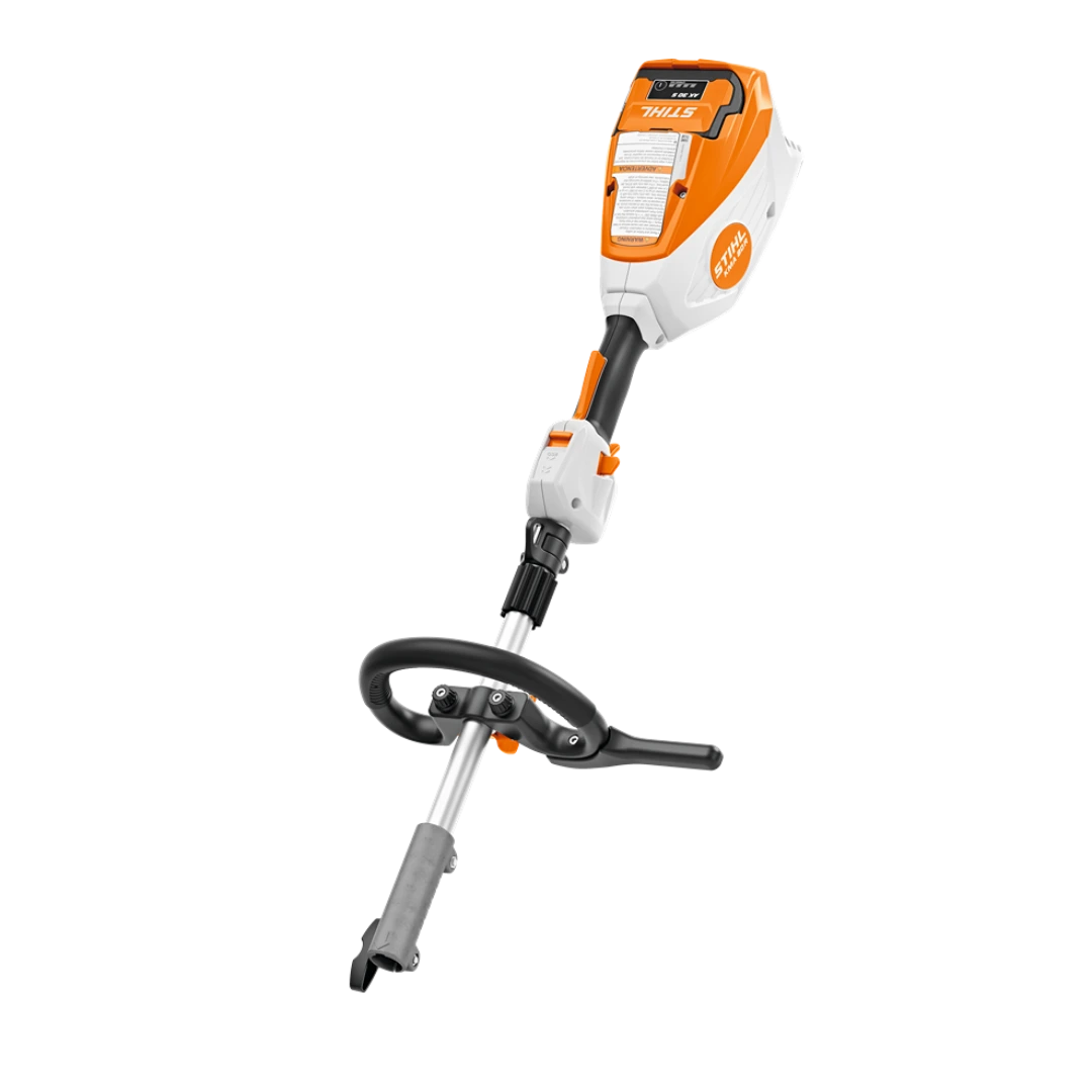 Compact STIHL battery-powered KombiMotor in orange and white for versatile outdoor power equipment tasks and lawn care.