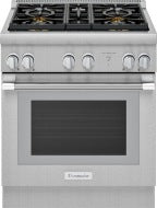 Stainless steel dual fuel range with six burner knobs and large glass oven door in Thermador kitchen appliances collection