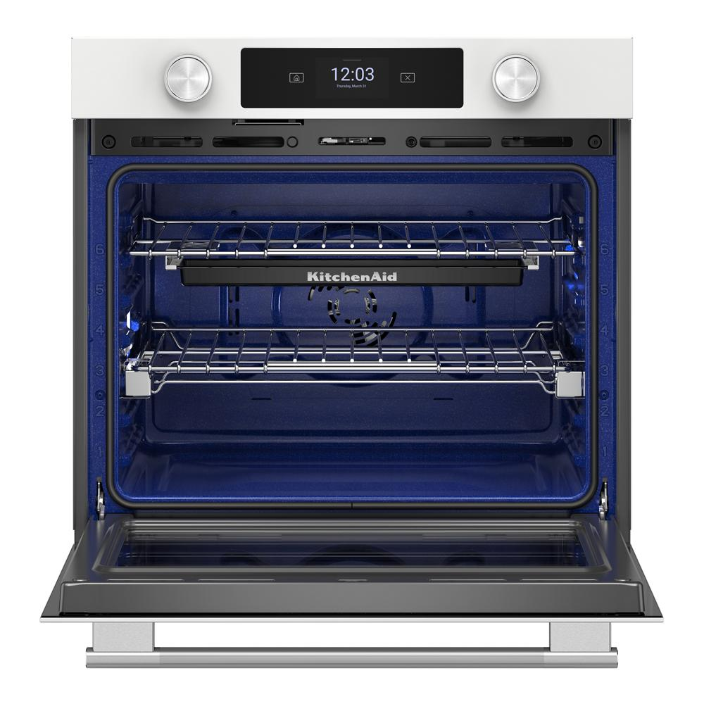 Open white smart electric wall oven with blue interior, LED touchscreen, and two chrome racks from KitchenAid collection