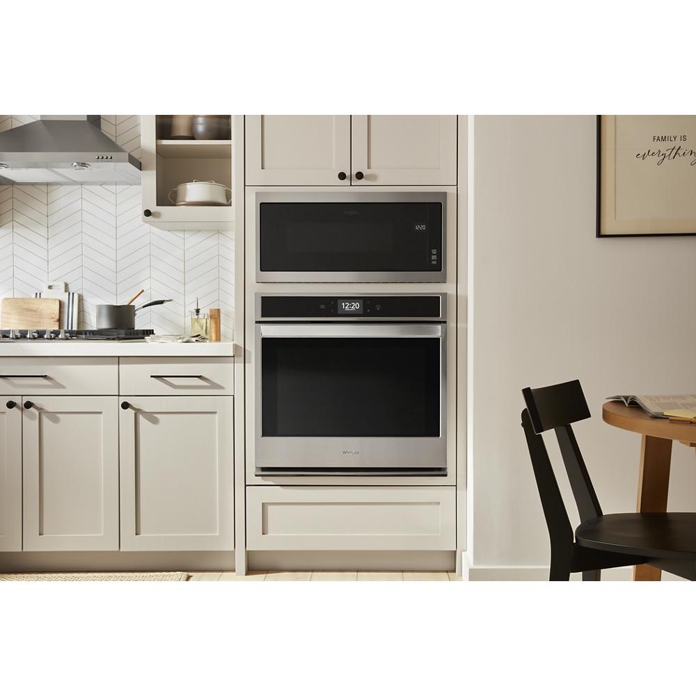 Modern kitchen with stainless steel built-in microwave and oven integrated into white cabinetry from Kitchen & Kitchenware collection