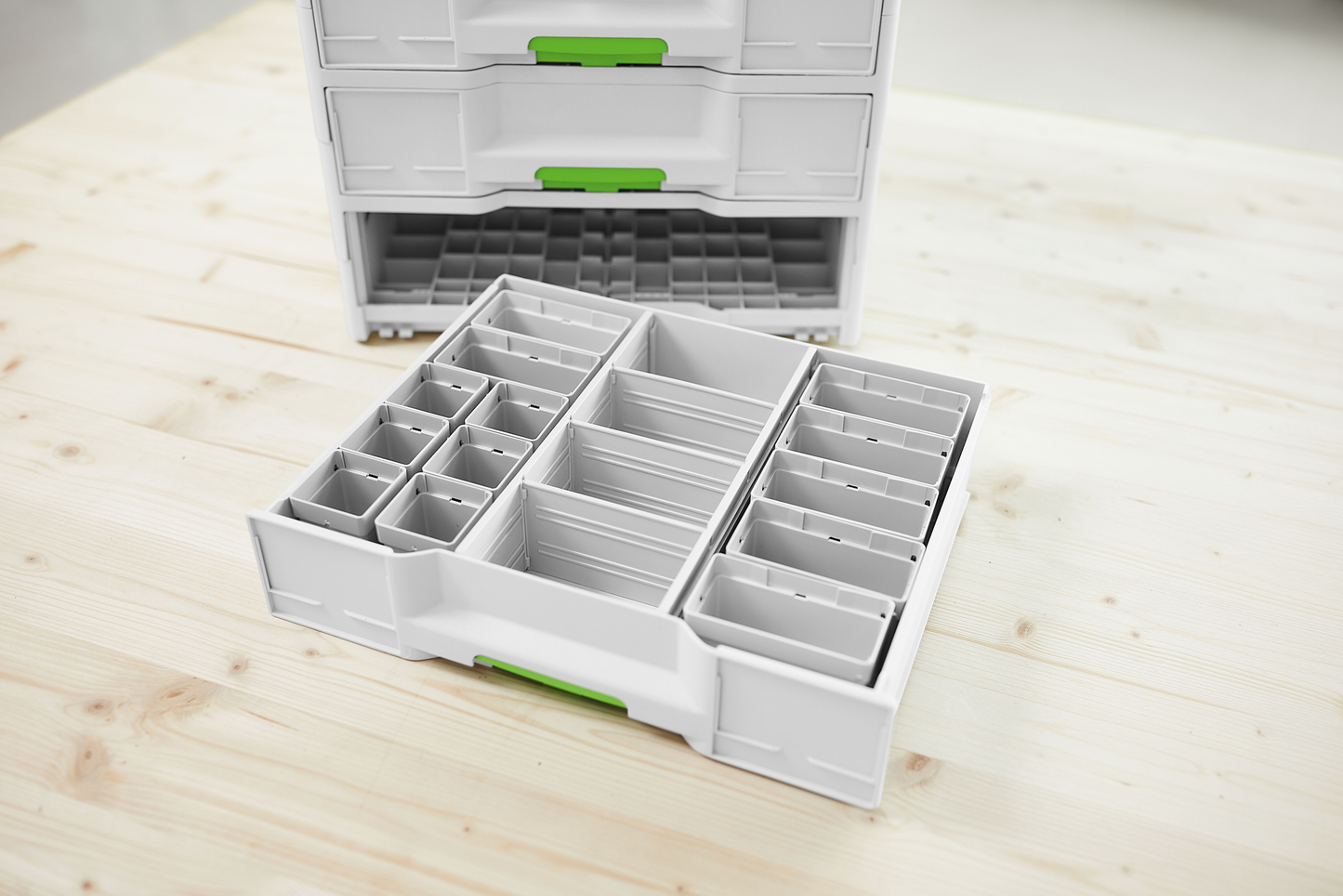 White plastic storage container with multiple adjustable compartments for workshop organization and tool storage accessories under $100