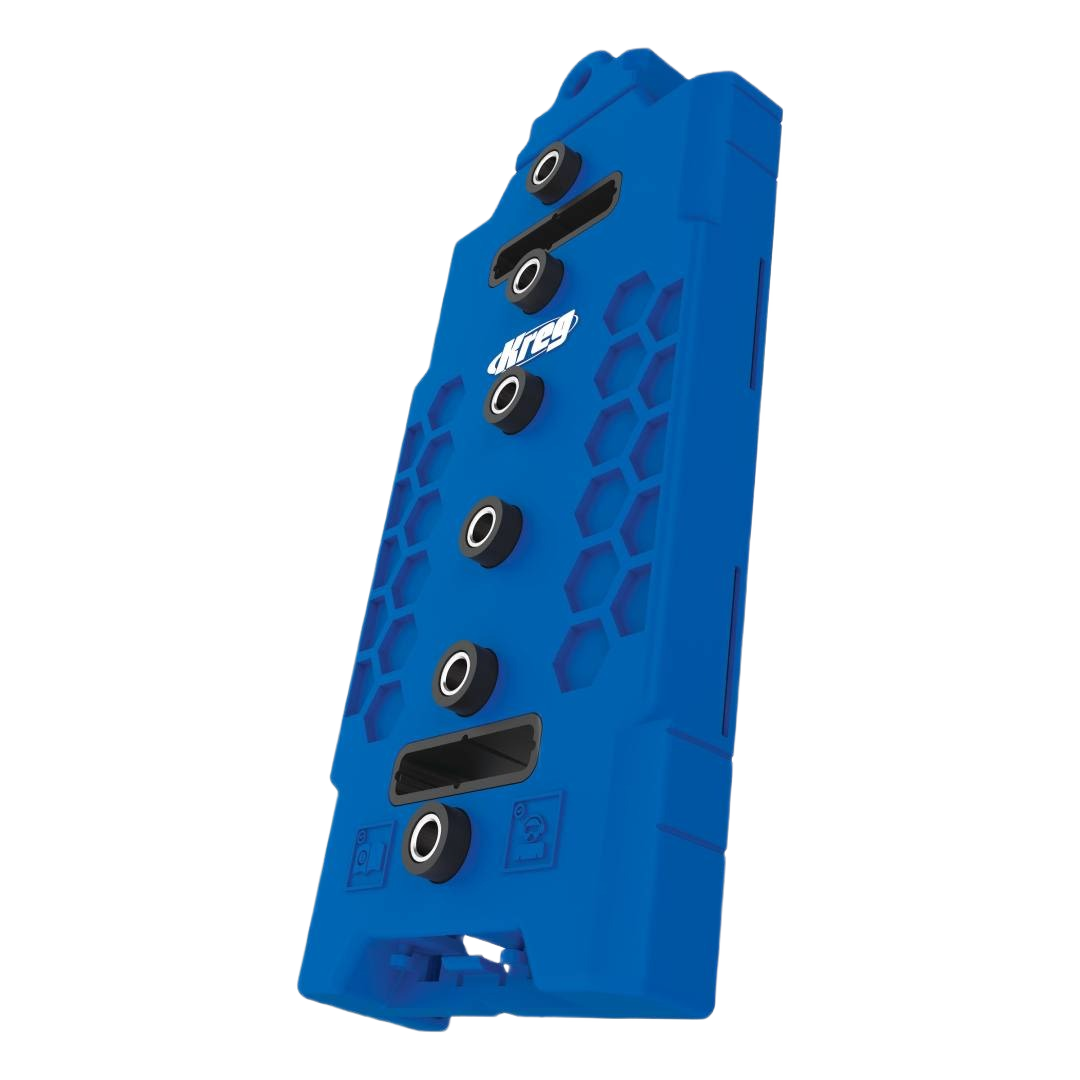 Blue plastic jig with metal guide bushings for precise shelf pin hole drilling in woodworking tool accessories