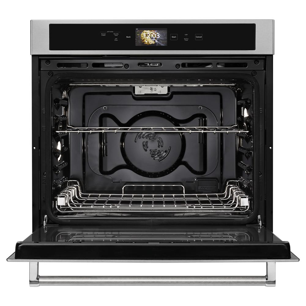 Open black interior of a 30-inch smart single wall oven with stainless steel trim and digital display panel