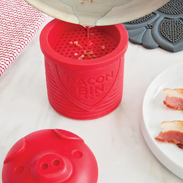 Red silicone Talisman Designs Bacon Bin with pig-face lid draining bacon grease for kitchenware and cooking utensils collections