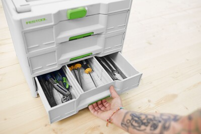 White and green Festool storage drawer open showing organized accessories for workshop and tool storage organization