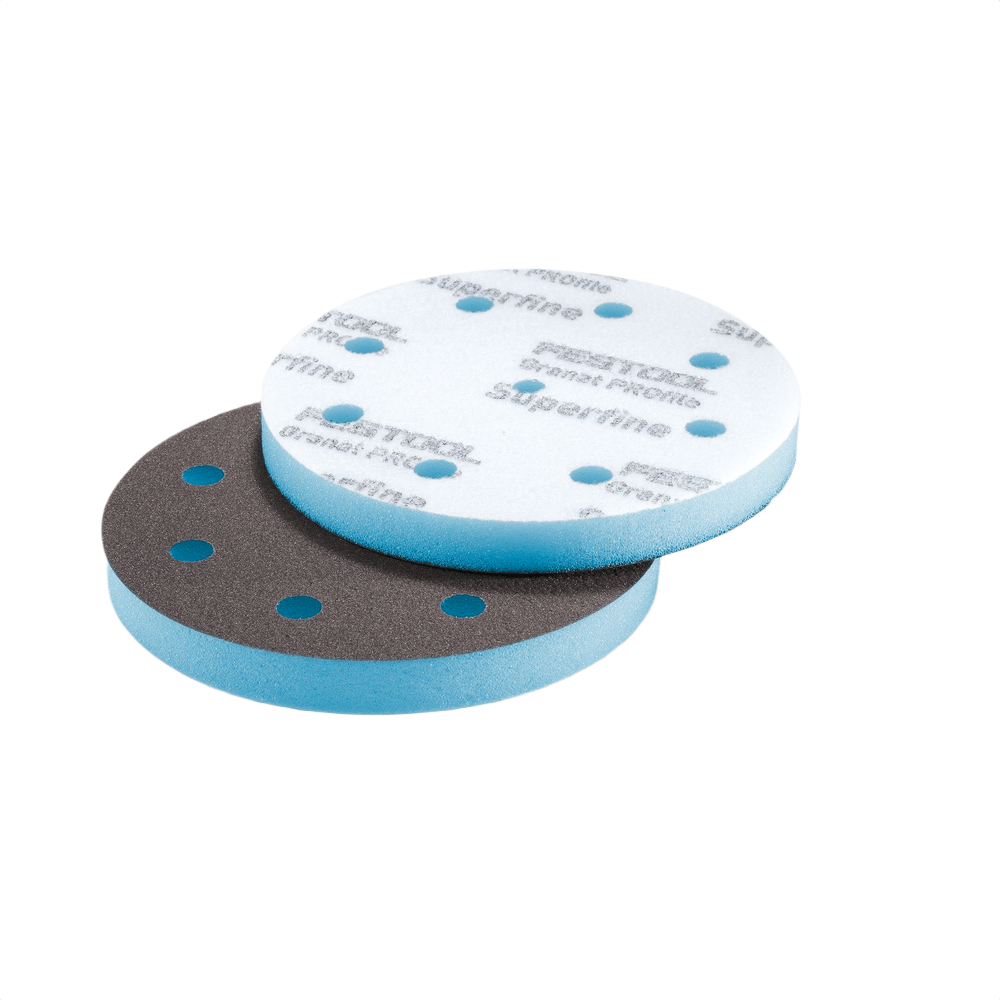 Two foam-backed sanding discs with perforations for dust extraction in power tool accessories for home improvement tasks