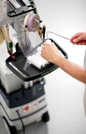 Compact Festool workcenter accessory tray holding paint rollers and painting tools for home improvement tasks