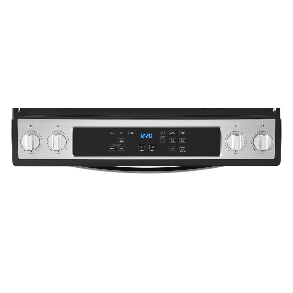 control panel close-up of Whirlpool electric range with digital display and stainless steel knobs for kitchen appliances