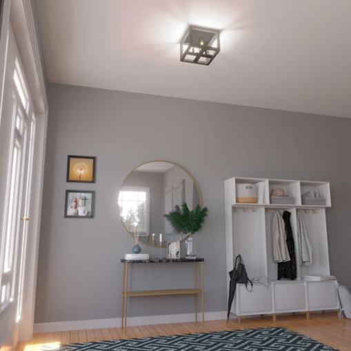 Matte black and dark ash four-light flush mount ceiling fixture in modern entryway with gray walls and hardwood floor