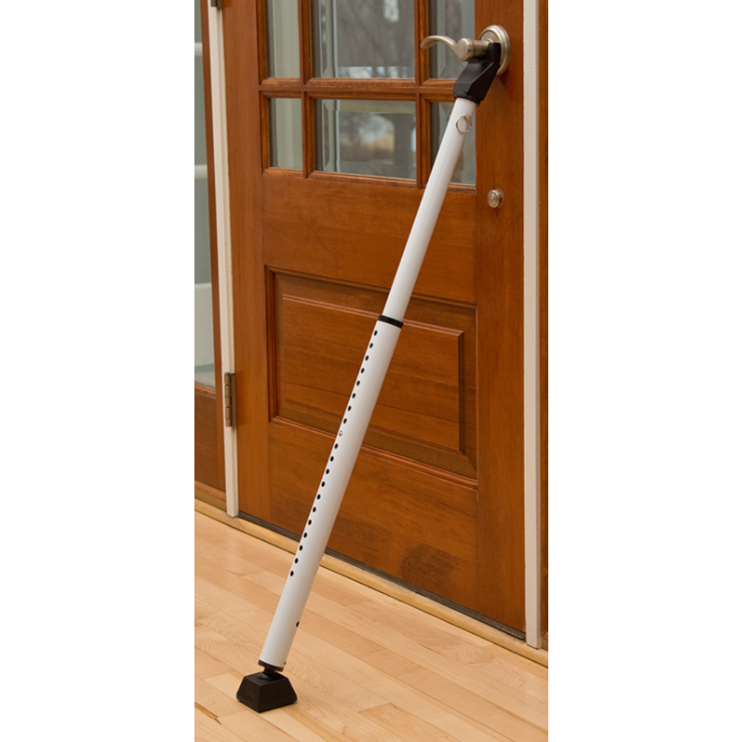 Adjustable steel security bar installed on a wooden door for home improvement in hardware collection