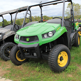 Green mid-size crossover utility vehicle with yellow Terra-Hawk tires for off-road and home improvement use
