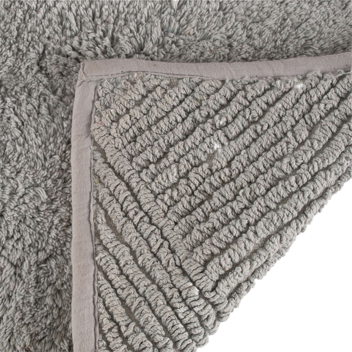 Gray reversible bath mat corner showing soft plush texture and woven pattern for bathroom safety and comfort