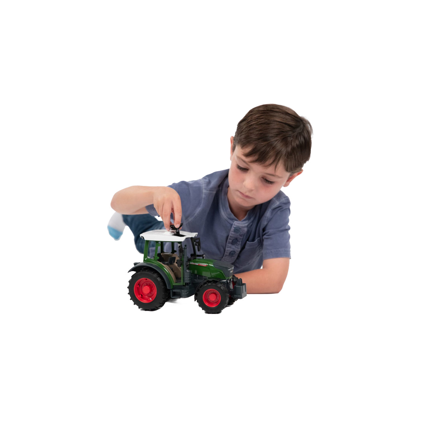 Young boy playing with green and red Bruder Fendt Vario 211 Tractor toy from Vehicles & Remote Controlled Toys collection