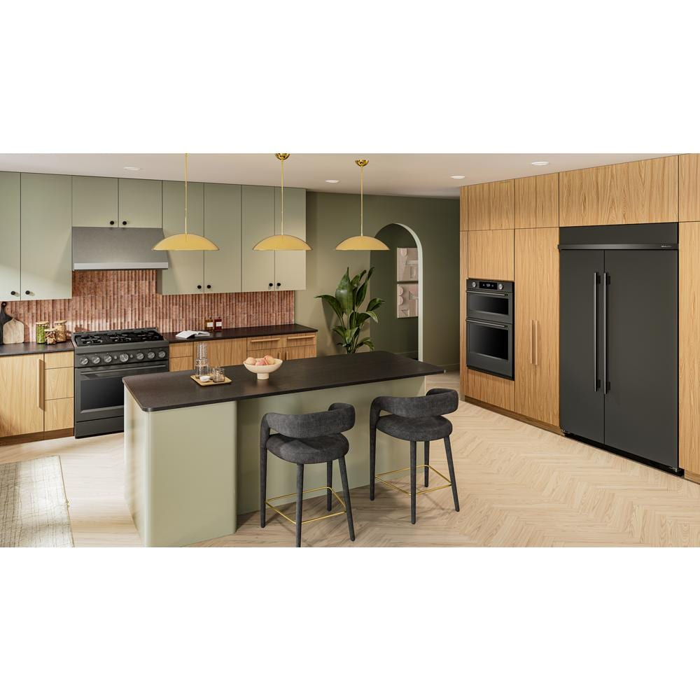 Modern kitchen featuring a dark finish KitchenAid 36-inch 6 burner gas range with matching appliances and wood cabinetry