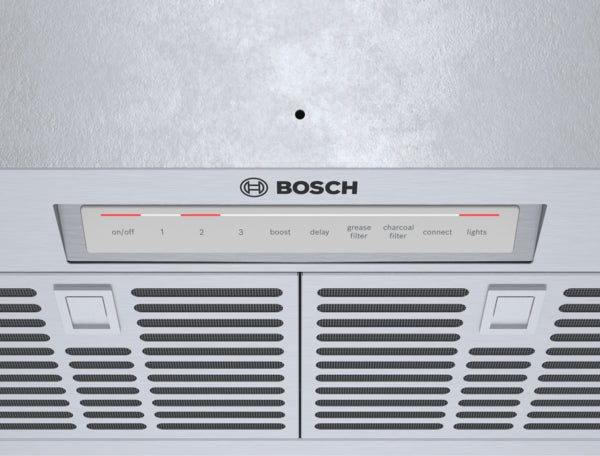 Control panel and vent grilles of stainless steel Bosch range hood insert for kitchen appliance ventilation system
