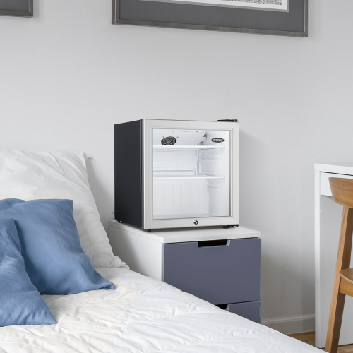 compact mini refrigerator with glass door and adjustable shelves in modern bedroom for kitchen and appliances
