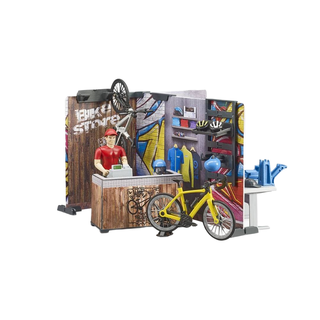 Miniature bike shop playset with figure, yellow bike, helmets, and accessories in Bruder Toys and Toys & Games collections