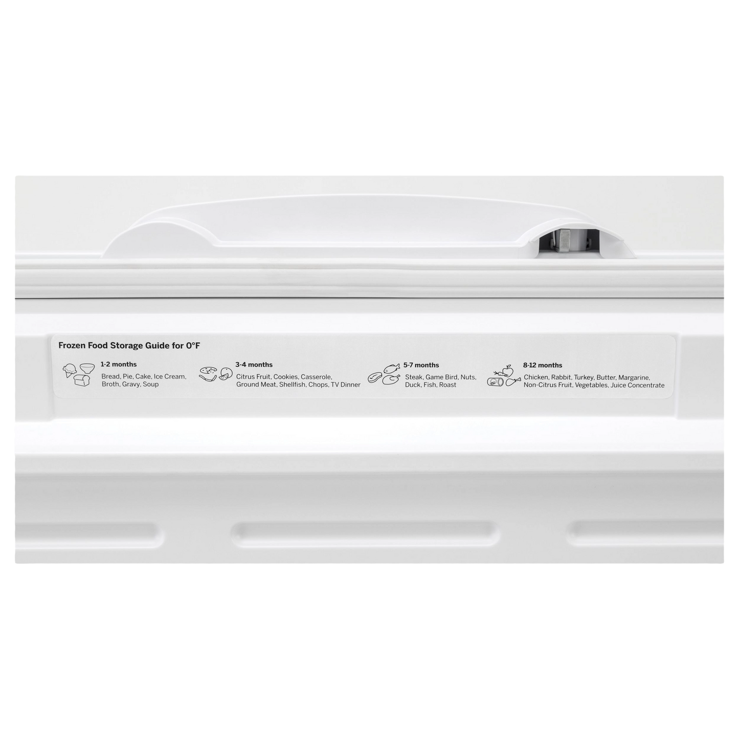 White chest freezer lid handle with frozen food storage duration guide label in kitchen appliance setting