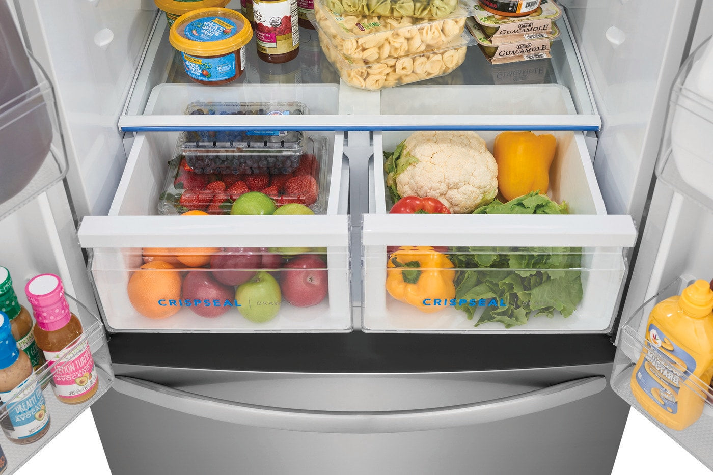 Open French door refrigerator drawers with fresh produce and clear CrispSeal® compartments in kitchen appliance collection
