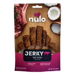 Package of Nulo beef jerky strips with coconut, pet treat displayed with beef cut and coconut halves on wooden surface