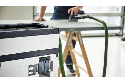 Compact cordless dust extractor with HEPA-Plus filter and green hose for woodworking and air filtration tools