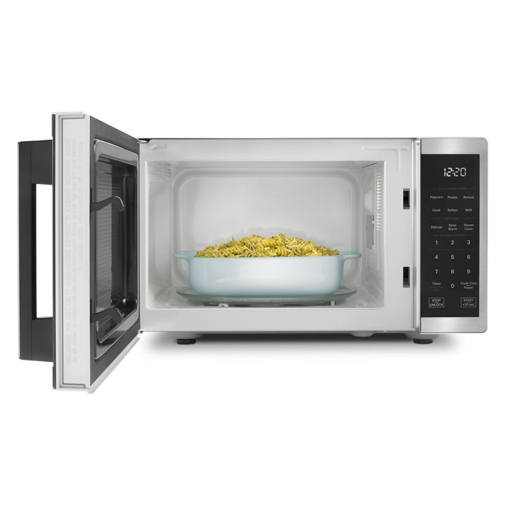 Stainless steel countertop microwave with open door, digital control panel, and white interior from Countertop Microwaves collection