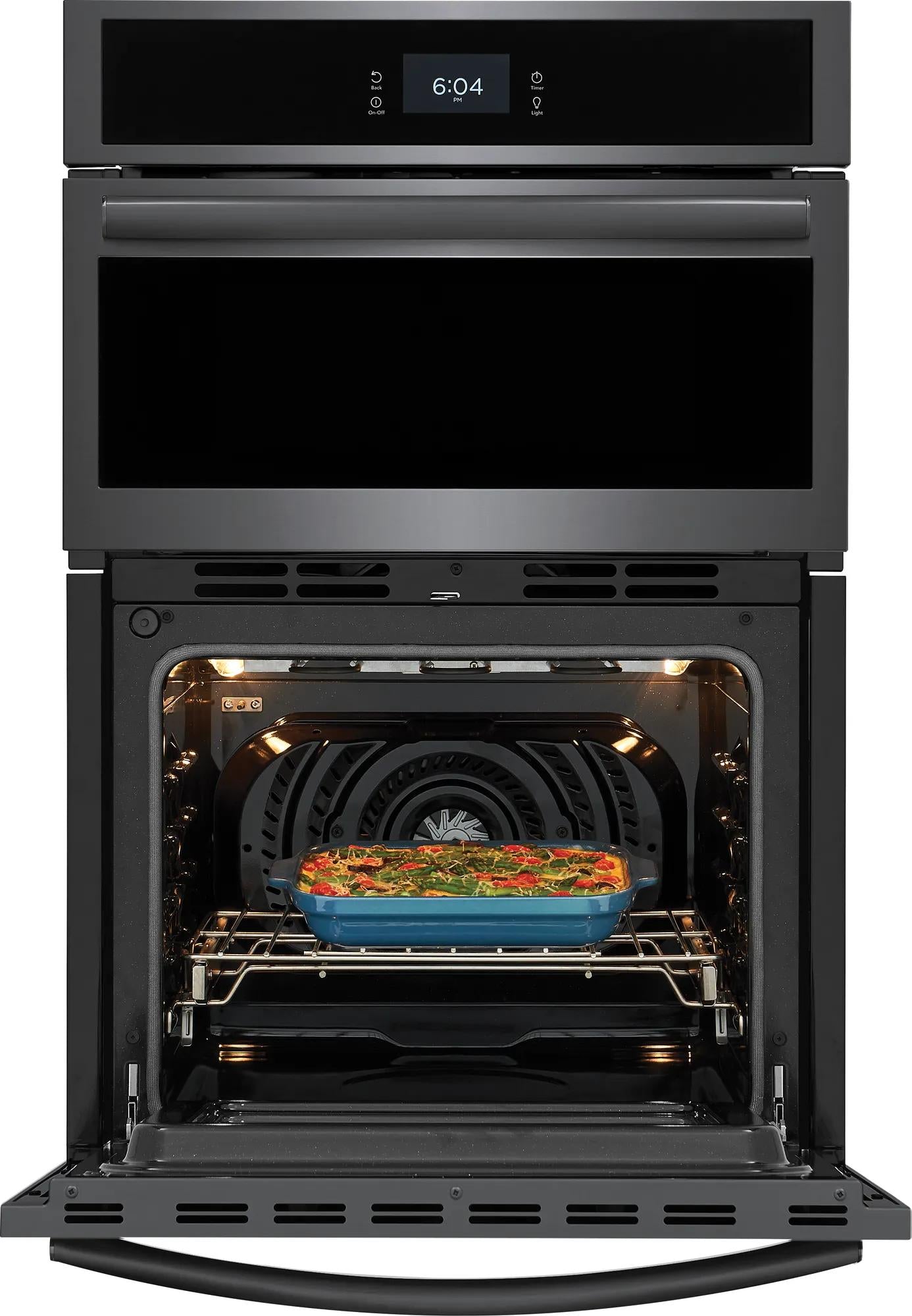 Black electric wall oven with digital display and convection cooking a casserole dish in a modern kitchen appliance