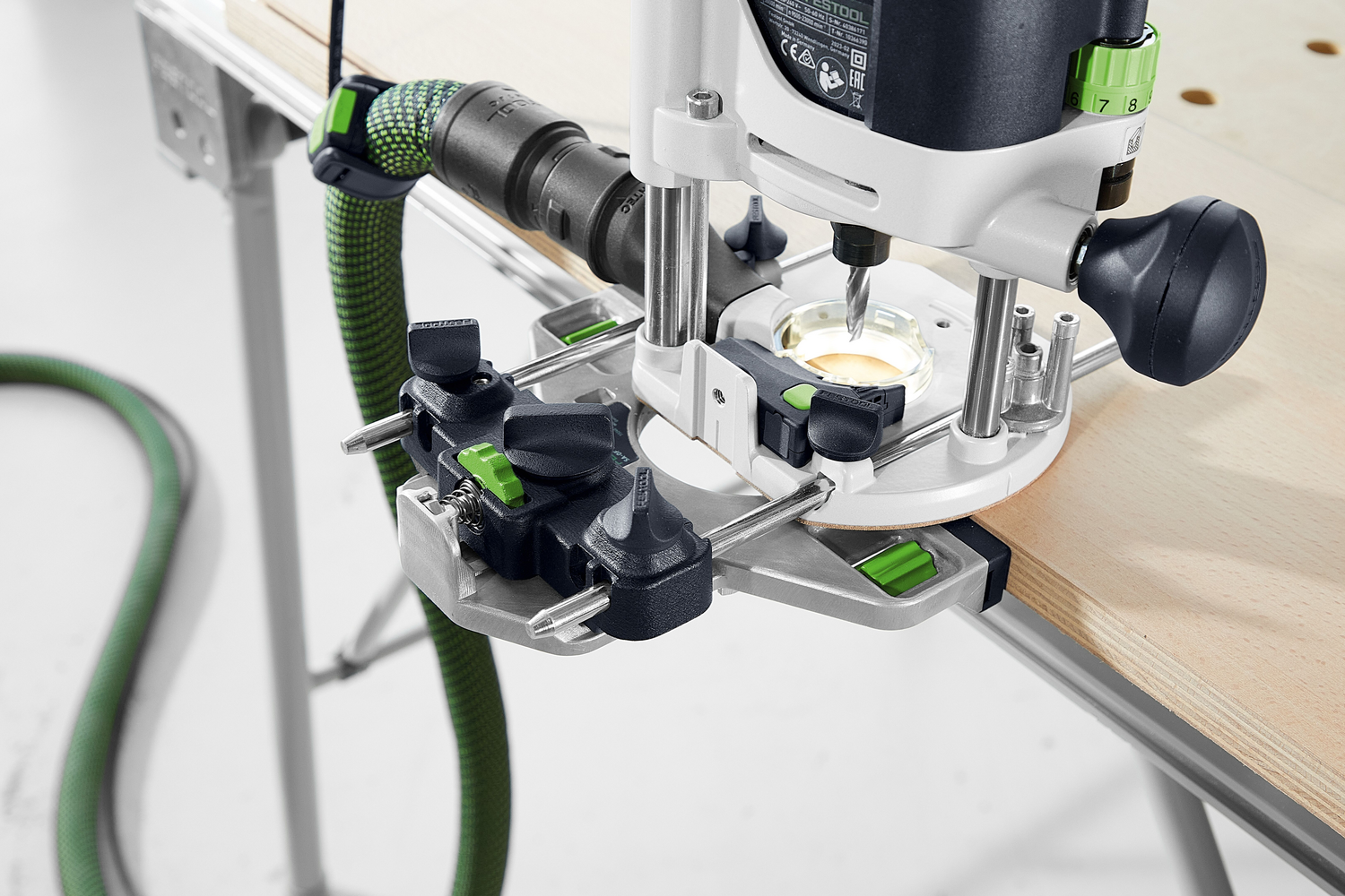 High-precision woodworking router with dust extraction hose attached, suited for professional and home improvement projects