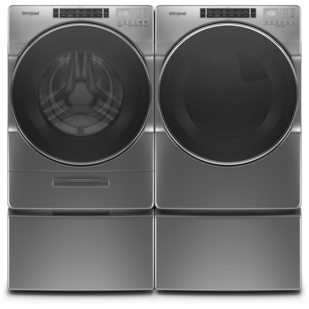 Stainless steel front load washer and matching dryer set with digital displays in modern laundry appliances collection