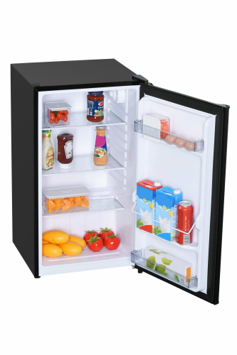 Compact black refrigerator with glass shelves, stocked with beverages, vegetables, and eggs in kitchen appliance collection.