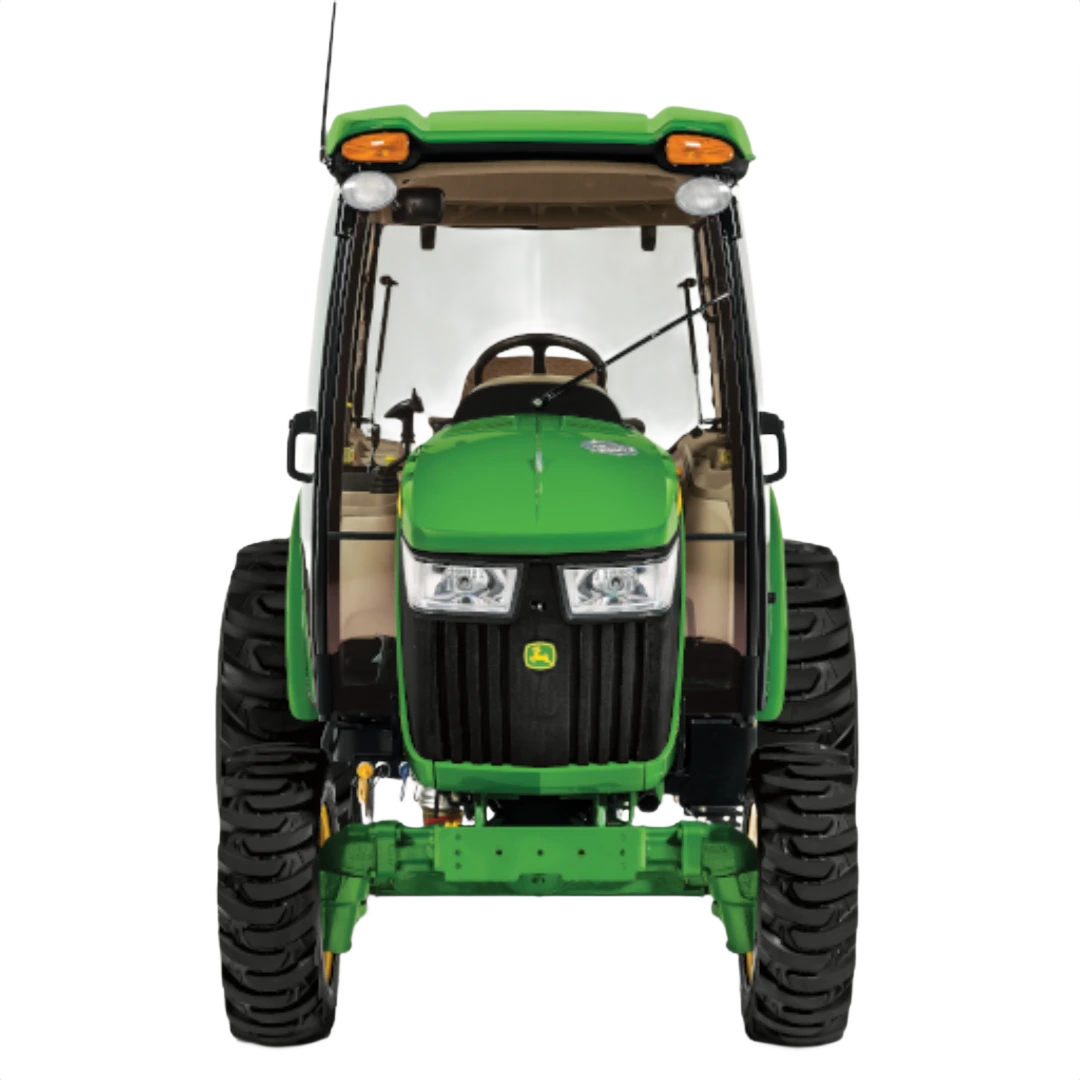 Front view of green John Deere compact tractor with ComfortGard cab, rugged tires, and visible steering wheel in Outdoor Power Equipment at Hartville Hardware.