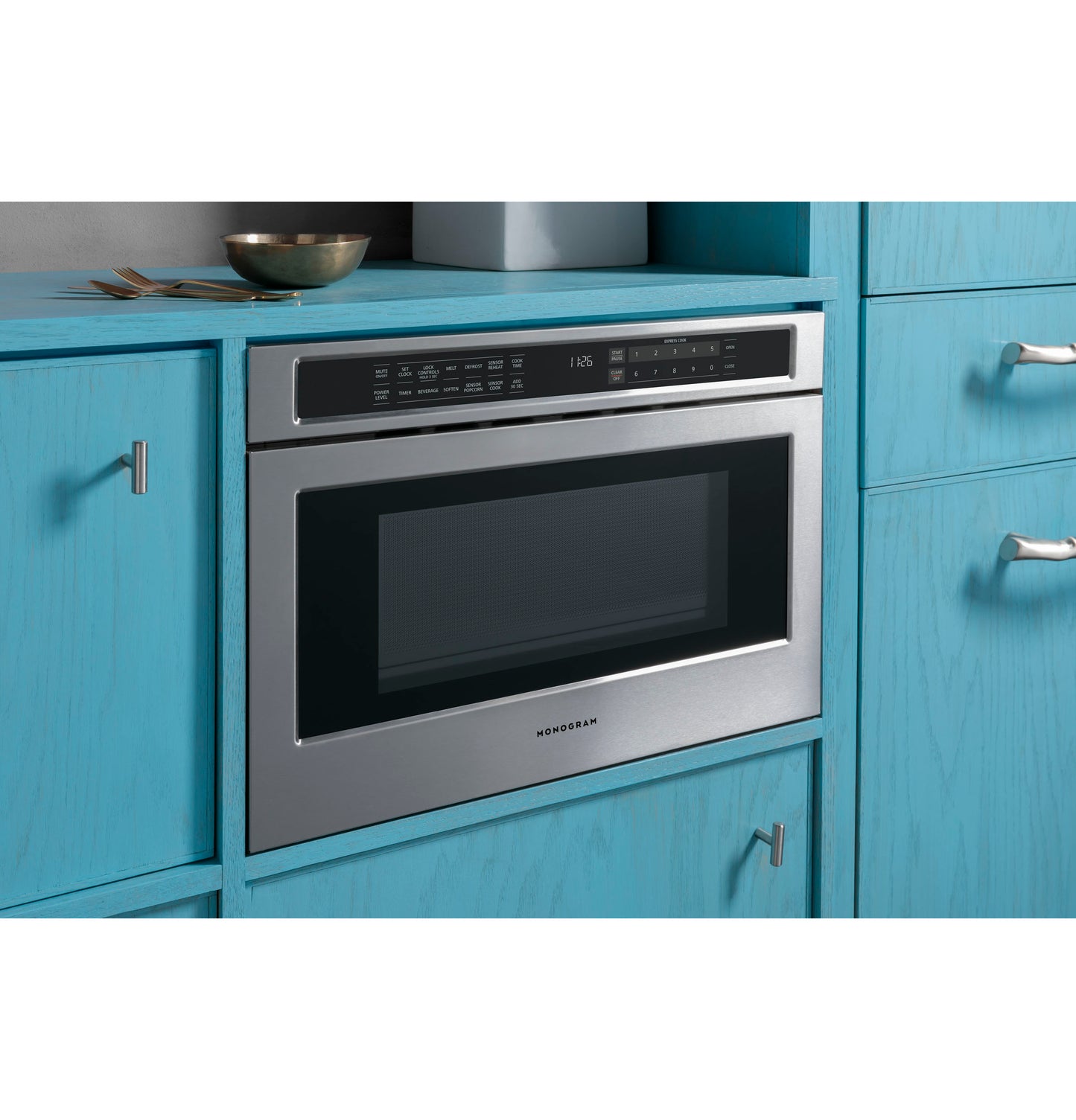 Built-in stainless steel microwave drawer with digital control panel in modern kitchen and appliances collection