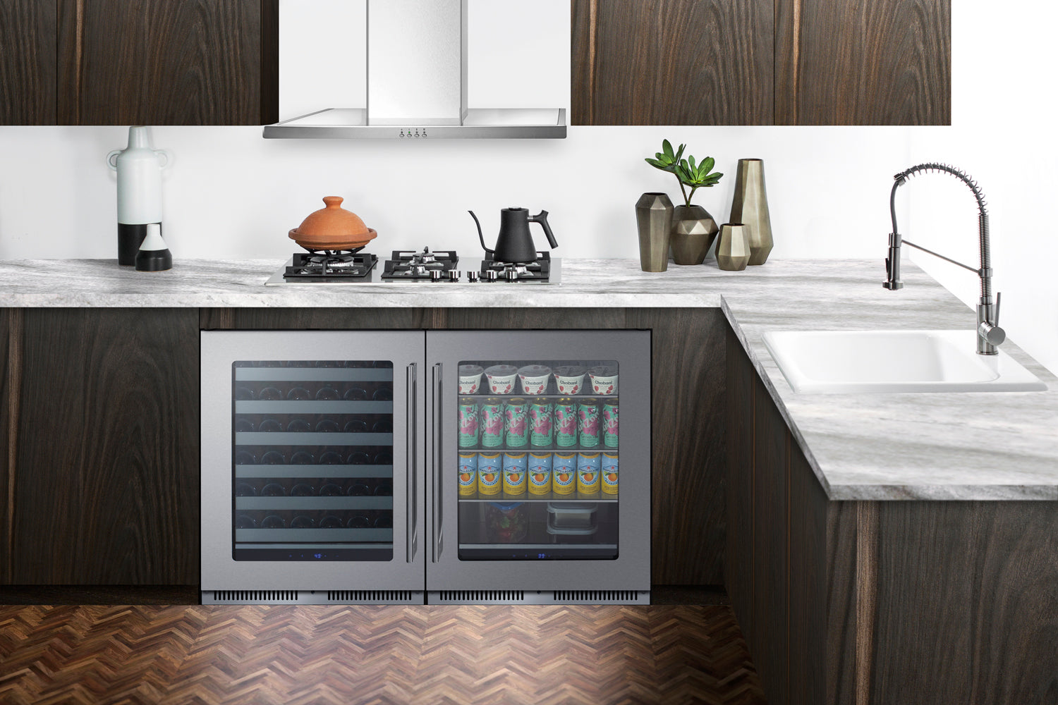 Built-in undercounter beverage center with dual glass doors, stocked with canned drinks, in modern kitchen setting