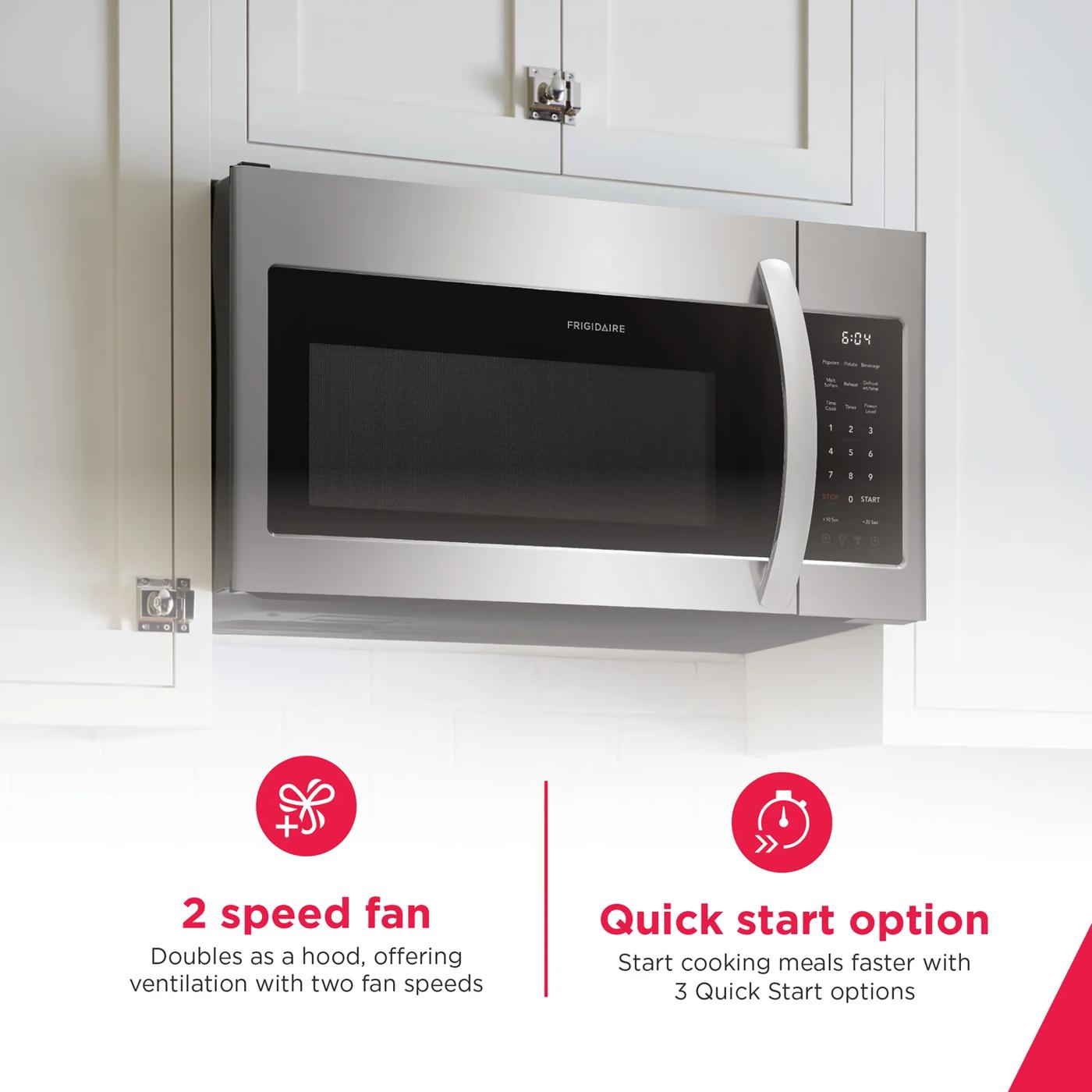 Stainless steel over-the-range microwave with digital keypad and curved handle in modern kitchen appliances collection