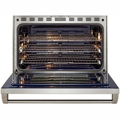 Open stainless steel oven with multiple adjustable wire racks and interior lighting for home cooking projects
