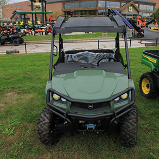 Olive green mid-size crossover utility vehicle with front brush guard and rugged off-road tires for outdoor tasks