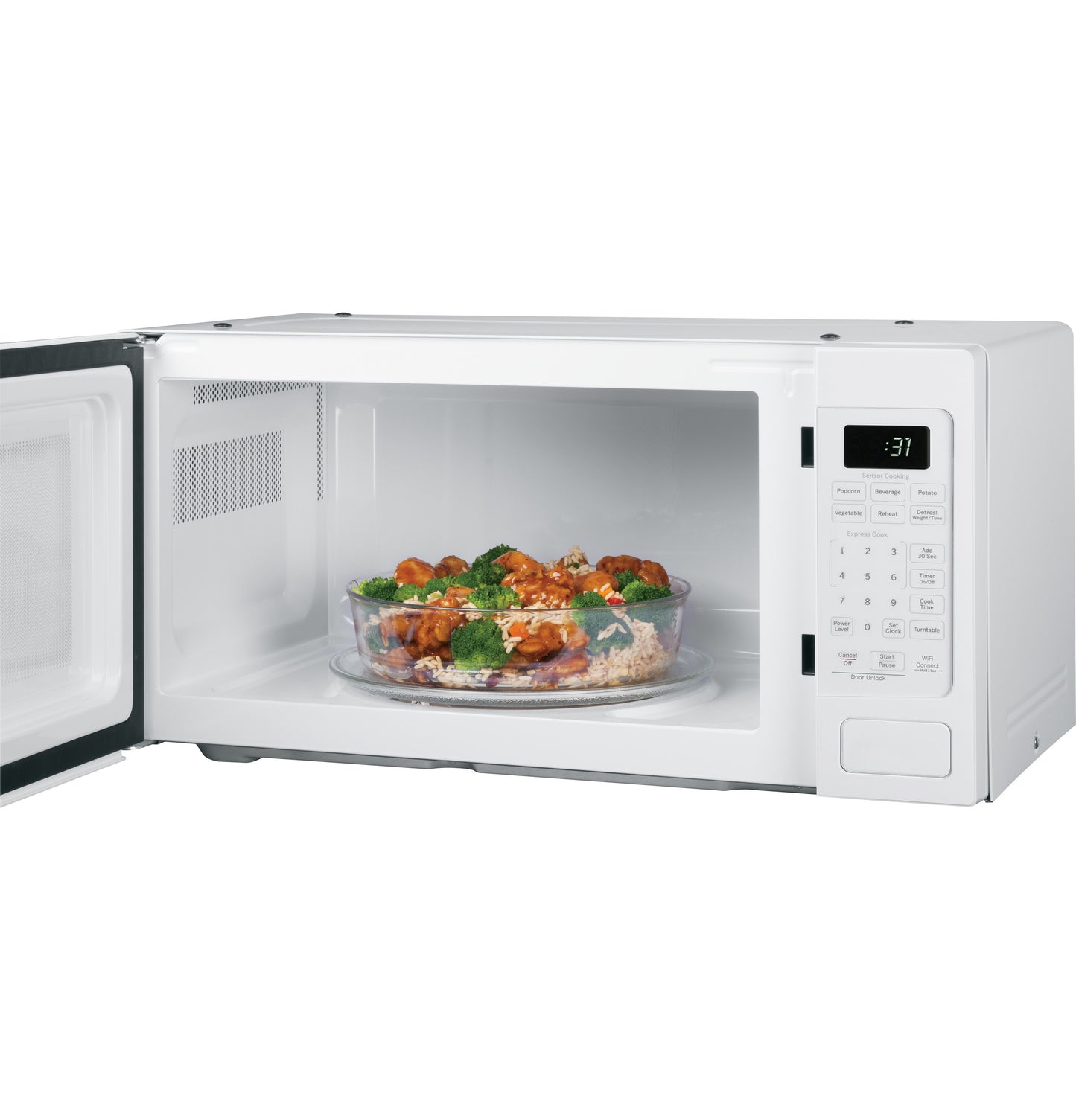 White countertop microwave oven open with glass bowl of food inside on turntable in kitchen appliances collection