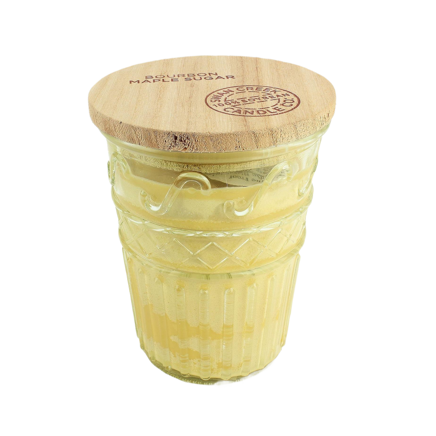 Yellow layered candle in textured glass jar with round wooden lid engraved with brand details