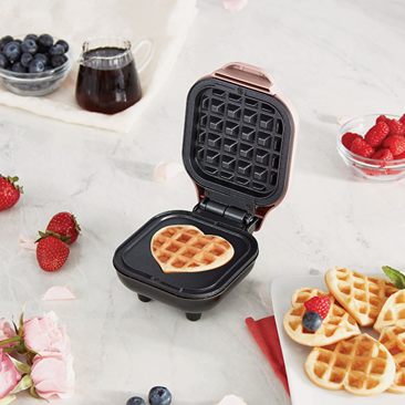 Pink mini heart-shaped waffle maker with non-stick surface in small kitchen appliances under $50 collection