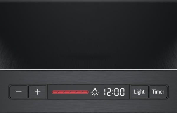 Close-up of black stainless steel range hood control panel with digital clock and lighting timer buttons