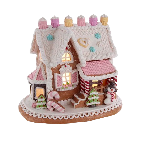 Decorative gingerbread house with pastel icing, candy details, and lights, perfect for indoor Christmas decorations