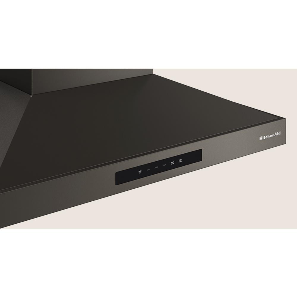 Matte black 30-inch wall-mount canopy hood with four-speed fan and power-boost function for efficient kitchen ventilation