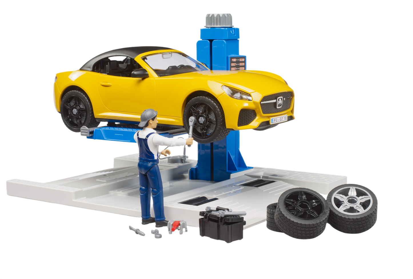 Yellow toy roadster lifted on blue hydraulic car lift with mechanic figure, tires, and toolbox in playset
