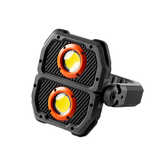 Compact dual-lens LED work light with black housing and orange ring accents for tools and home improvement use