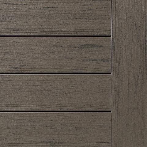 Close-up of grooved Silver Maple composite deck boards from TimberTech's PRO Terrain collection for outdoor decking projects