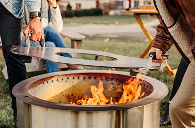 Hot-rolled carbon steel searplate with center opening and handles for outdoor fire pits and patio living collections