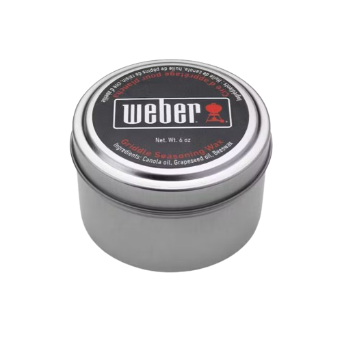 Silver metal tin of Weber griddle seasoning wax for protecting and maintaining outdoor cooking grill surfaces