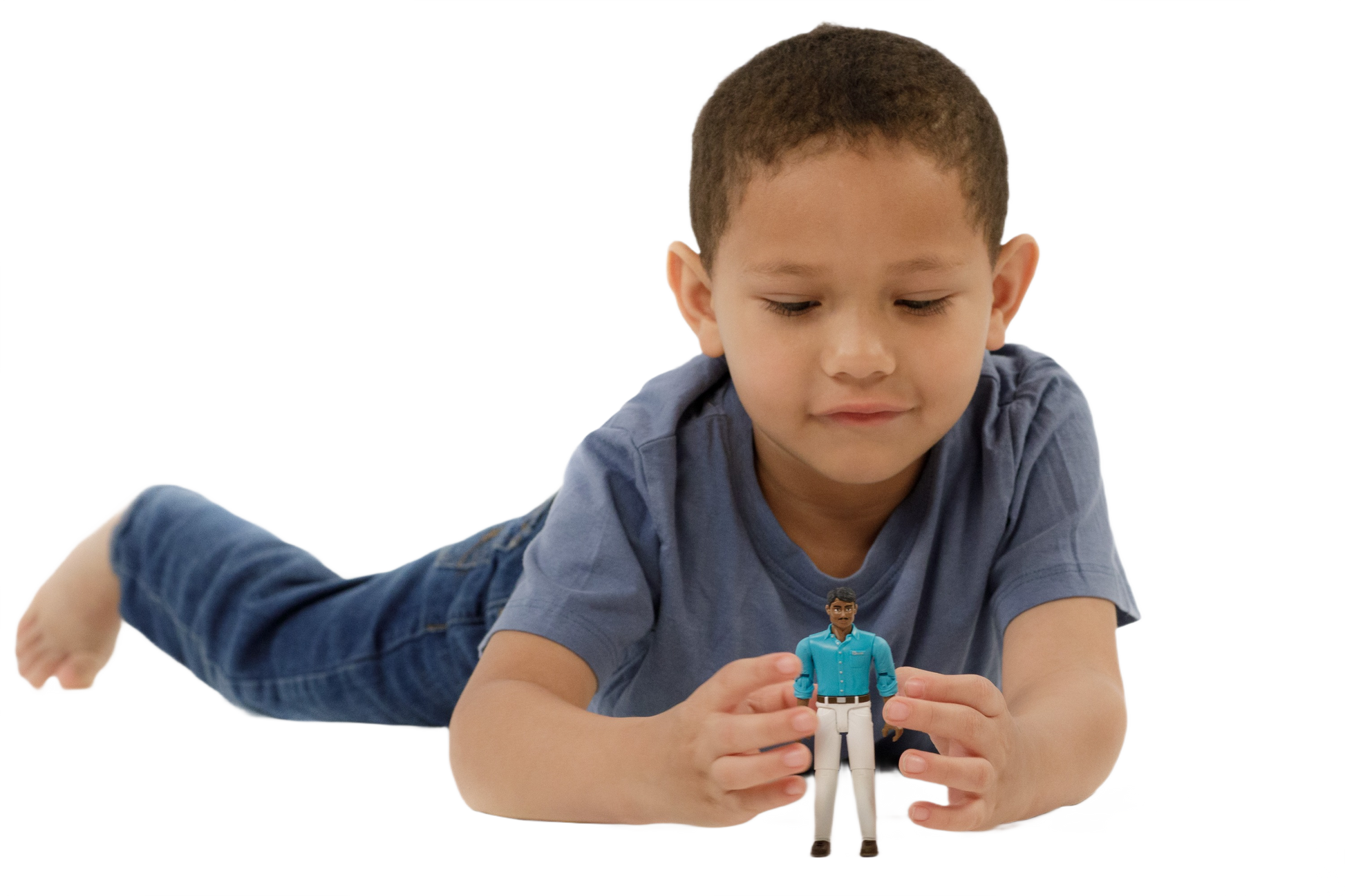 Young boy wearing blue shirt and jeans playing with articulated action figure in teal shirt and white pants
