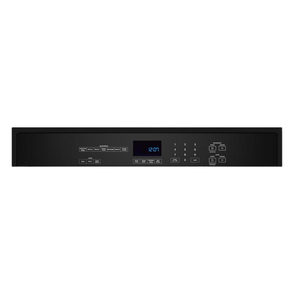 Control panel of a black microwave combo wall oven with digital clock and touch controls for cooking functions