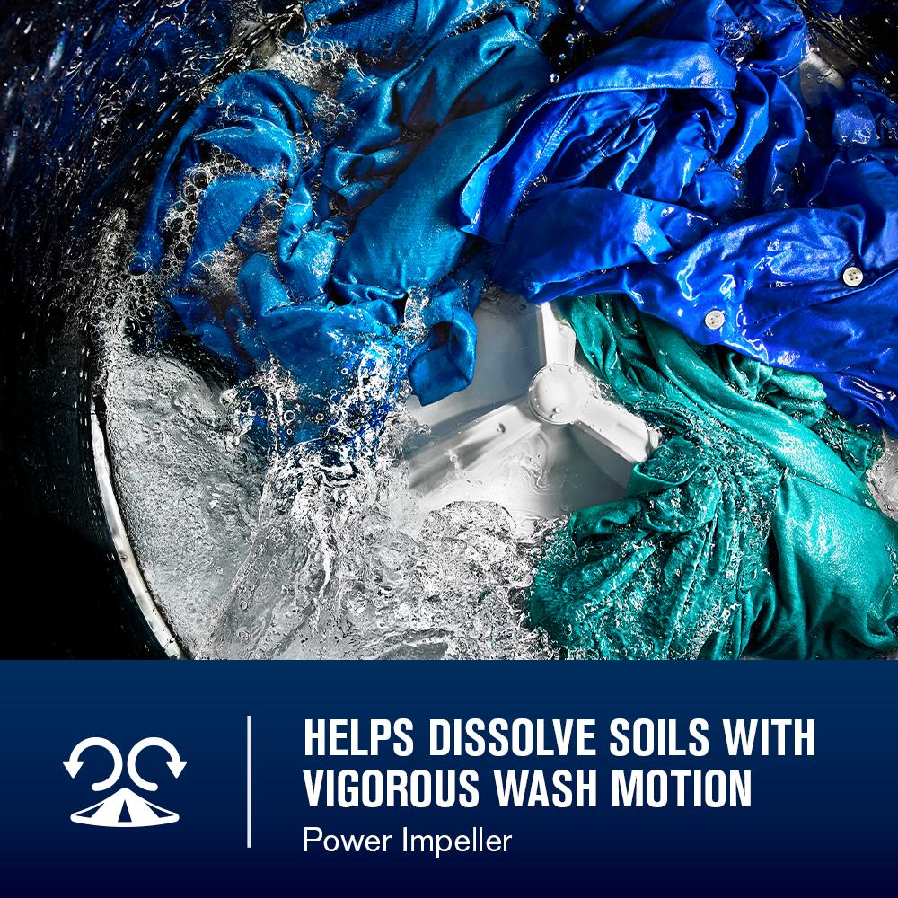 Inside view of top load washer soaking blue garments in water with vigorous wash motion in washers and dryers collection